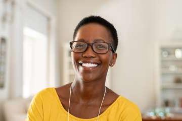 Smiling woman wearing yellow shirt